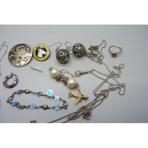 7123 - A collection of silver, white metal and other jewellery including an All Saints silver cross necklac... 