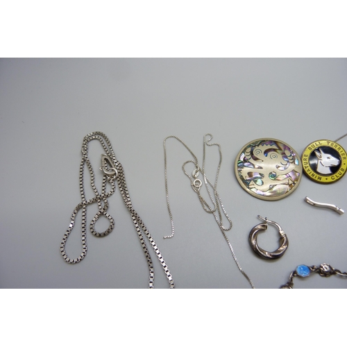 7123 - A collection of silver, white metal and other jewellery including an All Saints silver cross necklac... 