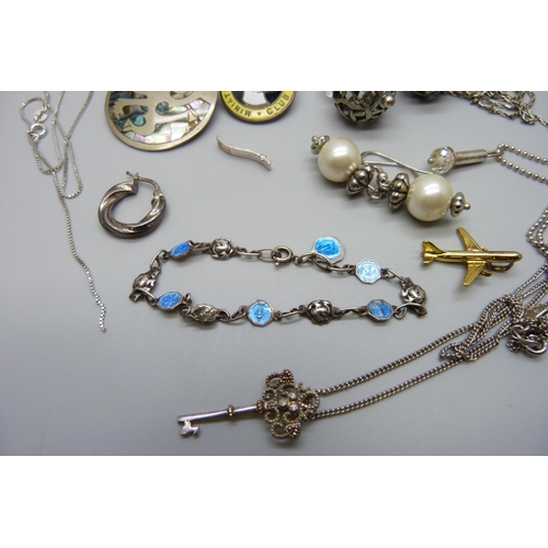 7123 - A collection of silver, white metal and other jewellery including an All Saints silver cross necklac... 