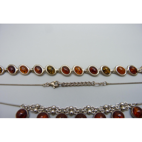 7139 - A white metal and amber bracelet, and a silver and amber necklace, 24g