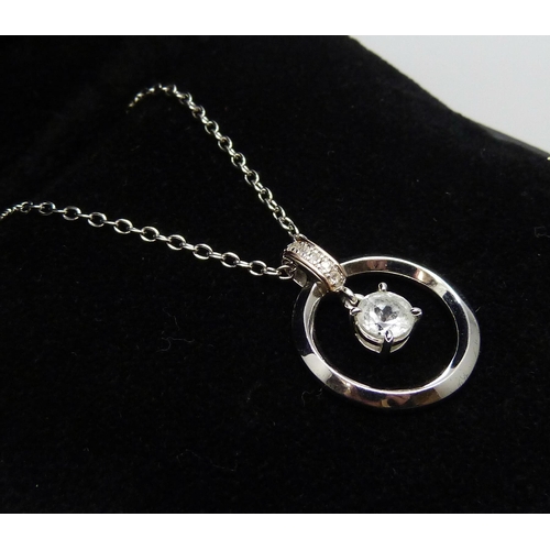 7147 - A Clogau Welsh silver pendant on a chain set with spinel stones, 2.4cm pendant