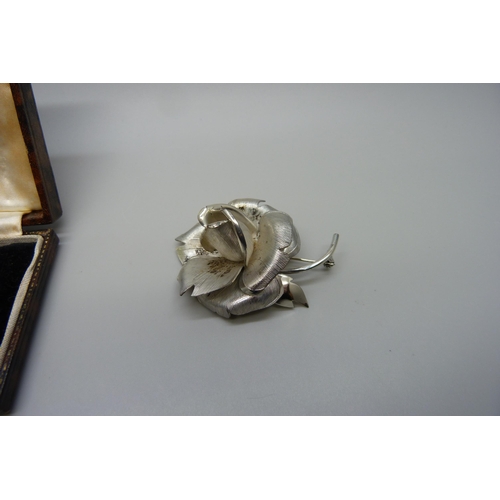 7155 - A pair of silver Art Deco paste set screw back earrings in fitted case, and a silver flower brooch, ... 