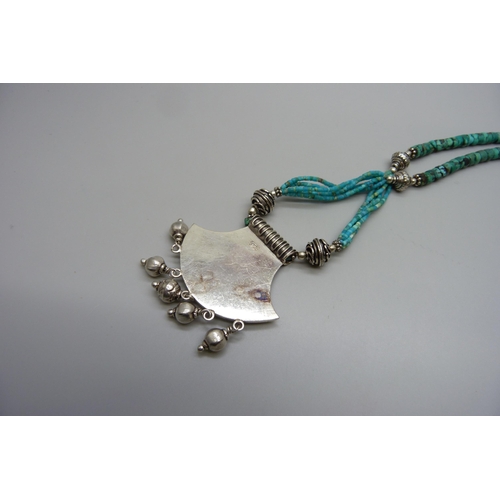 7162 - An Eastern silver and turquoise necklace, 43g