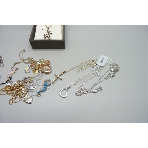 7166 - A collection of silver pendants and chains, 38g