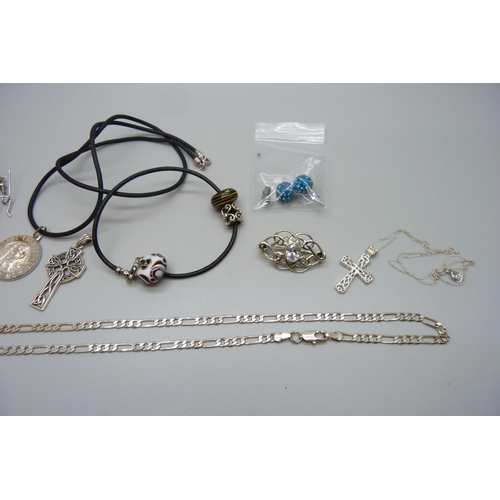 7172 - A collection of silver and white metal jewellery including earrings, a St Christopher, chain, etc.