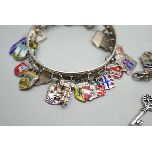 7198 - A silver charm bracelet, 37g, and a bangle with silver charms