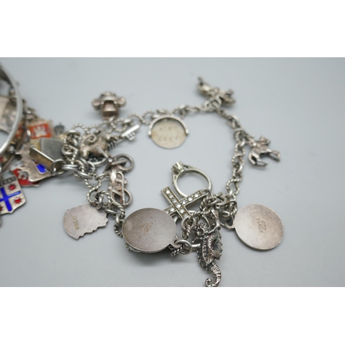 7198 - A silver charm bracelet, 37g, and a bangle with silver charms