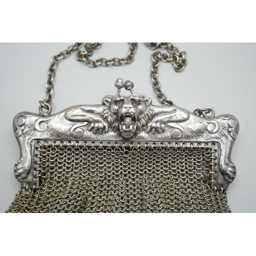 7204 - A mesh bag with lion design mount marked 'HHG Co. German silver', 12cm x 12.5cm