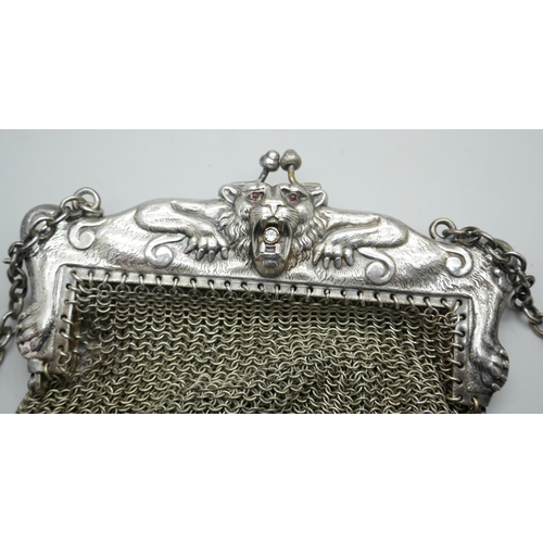 7204 - A mesh bag with lion design mount marked 'HHG Co. German silver', 12cm x 12.5cm