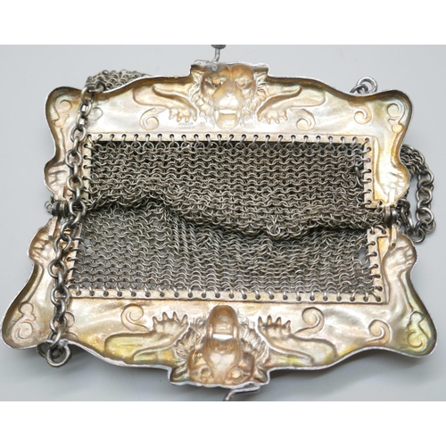 7204 - A mesh bag with lion design mount marked 'HHG Co. German silver', 12cm x 12.5cm