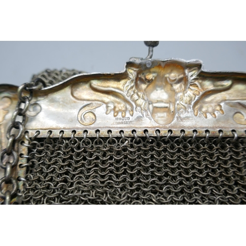 7204 - A mesh bag with lion design mount marked 'HHG Co. German silver', 12cm x 12.5cm