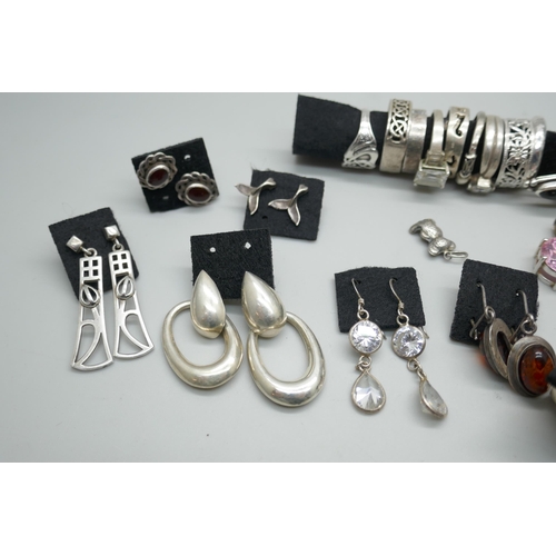 7208 - A collection of silver and white metal rings and earrings