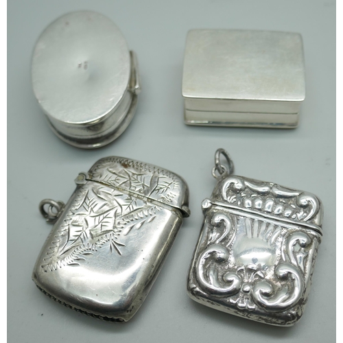 7209 - Two silver pill boxes and two silver vesta cases, 58g