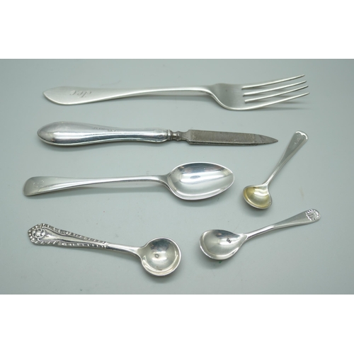 7223 - A silver fork, spoons etc., 49g