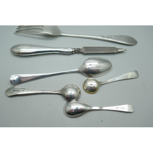 7223 - A silver fork, spoons etc., 49g