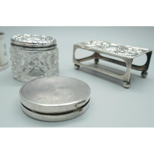 7224 - A silver match box cover, a white metal match box cover, a silver napkin ring, a silver compact (a/f... 