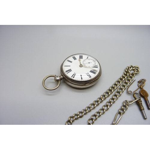 7261 - A silver cased pocket watch, Chas. Heselwood of York pocket watch, London 1874, a chain and two keys