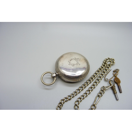 7261 - A silver cased pocket watch, Chas. Heselwood of York pocket watch, London 1874, a chain and two keys