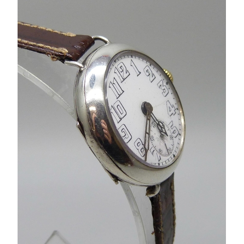 7265 - A silver cased trench wristwatch, import mark London 1916, 32mm case with new strap