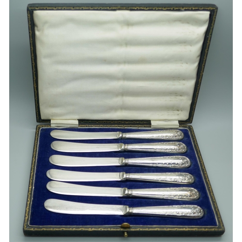 7317 - Six cased butter knives with silver covered handles