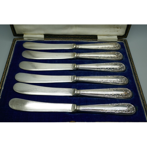 7317 - Six cased butter knives with silver covered handles