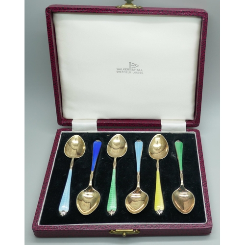 7322 - A cased set of six silver gilt and enamel spoons, by Adie Bros., in a Walker & Hall box, enamel on f... 