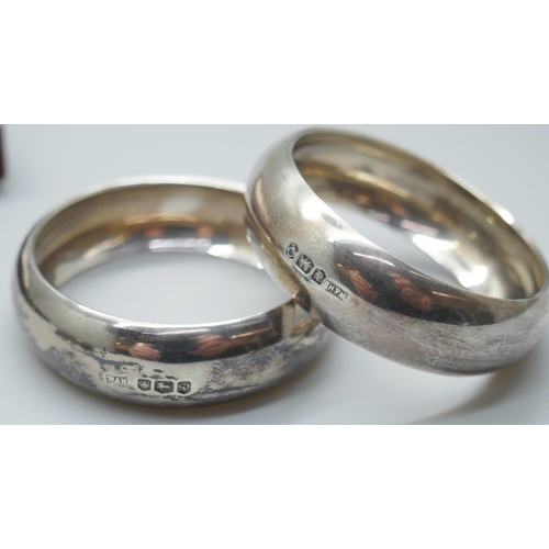 7323 - A cased pair of silver napkin rings, Walker & Hall, Sheffield 1958, 31g, and one other