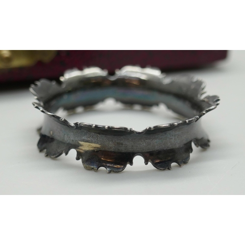 7323 - A cased pair of silver napkin rings, Walker & Hall, Sheffield 1958, 31g, and one other