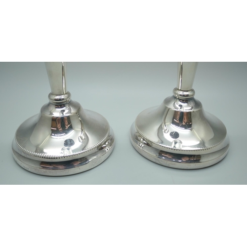 7328 - A pair of silver candlesticks, 20cm