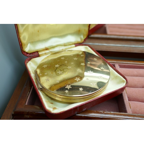 7334 - Two silver brushes, a plated card case, two compacts and costume jewellery in a jewellery box