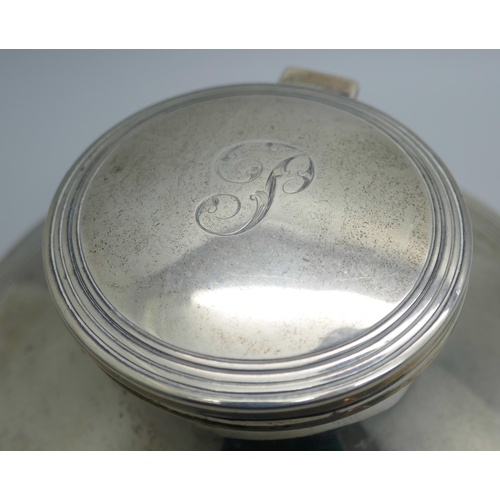 7336 - A silver Capstan inkwell, Sheffield 1920, diameter of base 14.5cm