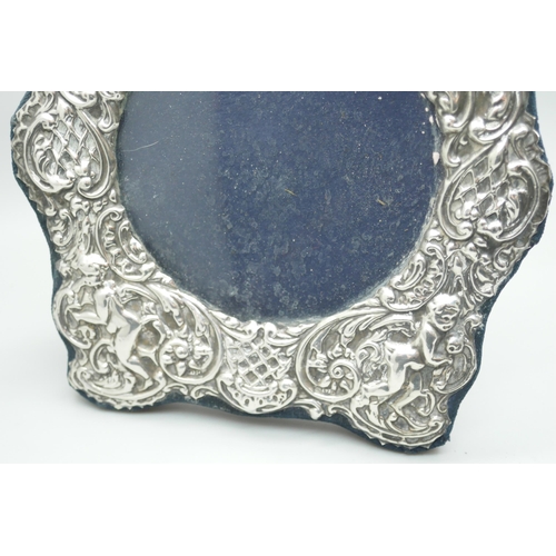 7339 - An embossed silver photograph frame, London 1988, 15cm wide