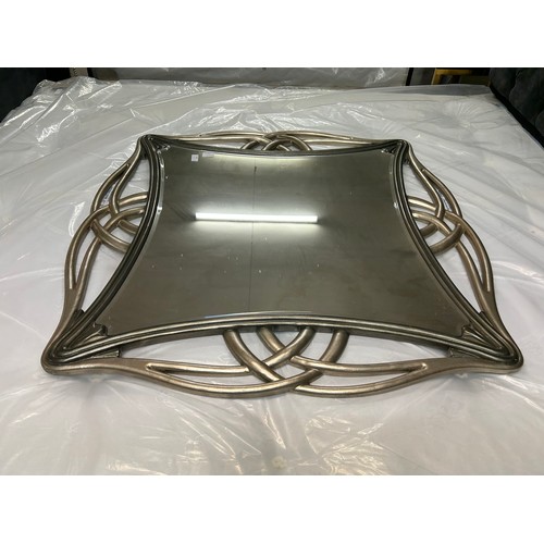 3053 - A large silver mirror