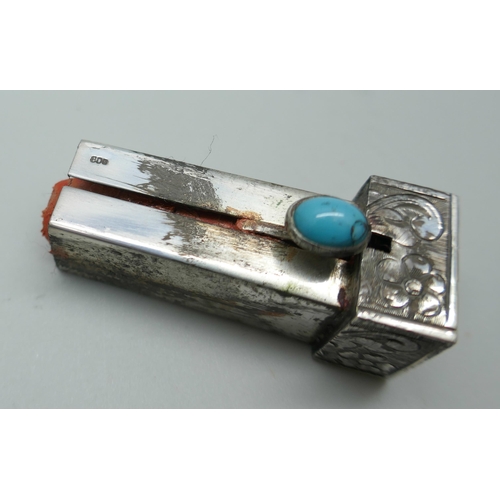 7345 - An engraved silver lipstick holder set with turquoise