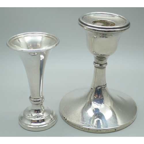 7350 - A silver candlestick, Birmingham 1927 and a silver vase, Sheffield 1980, weighted, vase 8.5cm