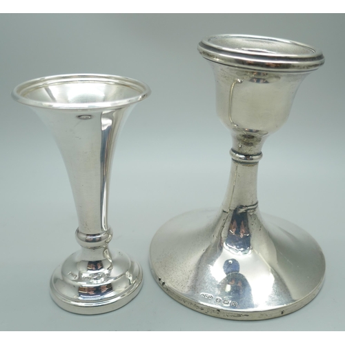 7350 - A silver candlestick, Birmingham 1927 and a silver vase, Sheffield 1980, weighted, vase 8.5cm