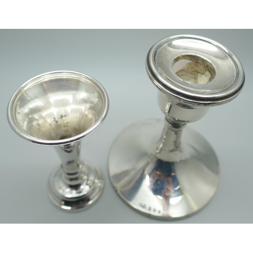 7350 - A silver candlestick, Birmingham 1927 and a silver vase, Sheffield 1980, weighted, vase 8.5cm