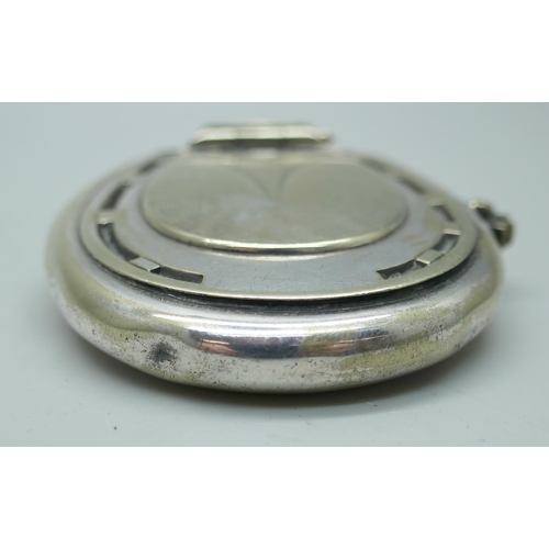 7351 - A novelty silver plated horseshoe shaped vesta case/lighter combination, 5cm x 5cm