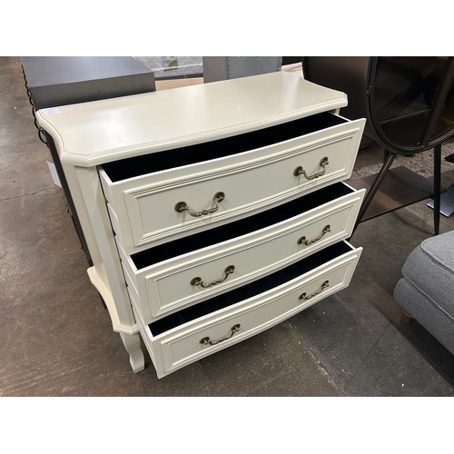 3064 - An antique white three drawer chest