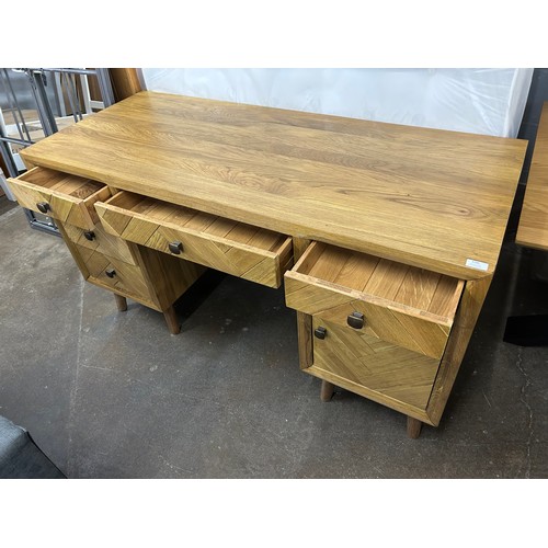 3132 - A brushed and glazed solid oak desk