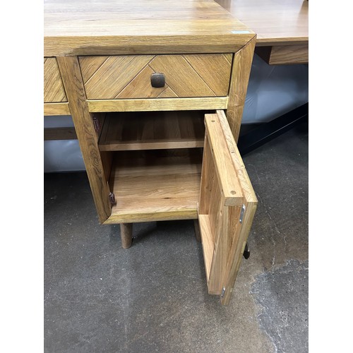 3132 - A brushed and glazed solid oak desk