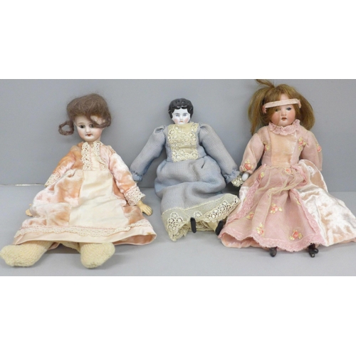 2023 - Three dolls including two circ 1900