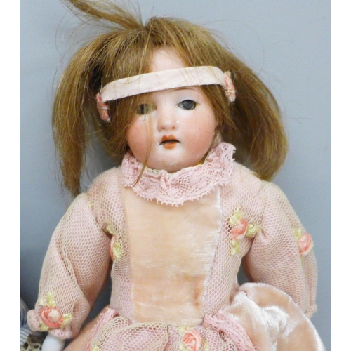 2023 - Three dolls including two circ 1900