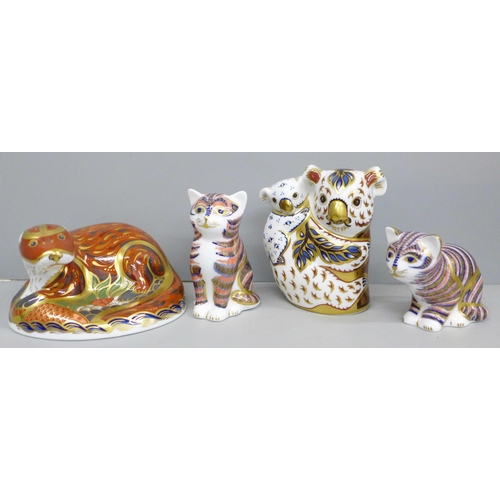 2024 - A collection of Royal Crown Derby paperweights, an Otter, Koalas and Kittens x 2, all with stoppers,... 