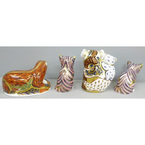 2024 - A collection of Royal Crown Derby paperweights, an Otter, Koalas and Kittens x 2, all with stoppers,... 