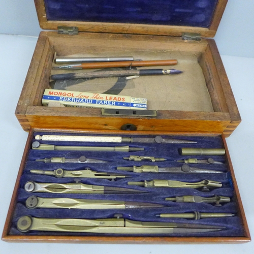 2033 - A set of drawing instruments in a wooden case