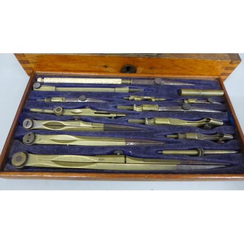 2033 - A set of drawing instruments in a wooden case