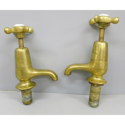 2036 - A pair of brass taps made by A Goslett & Co Ltd. London