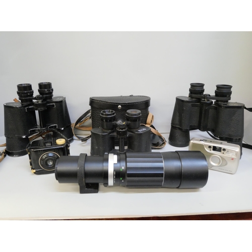 2140 - A pair of cased Russian binoculars and cameras, etc.