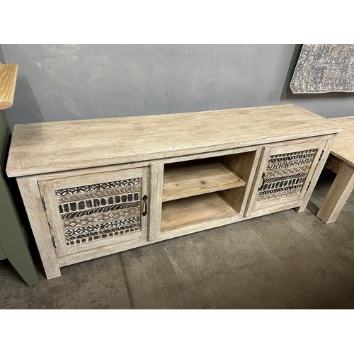 3038 - A wooden TV cabinet with a sandblast antique white finish